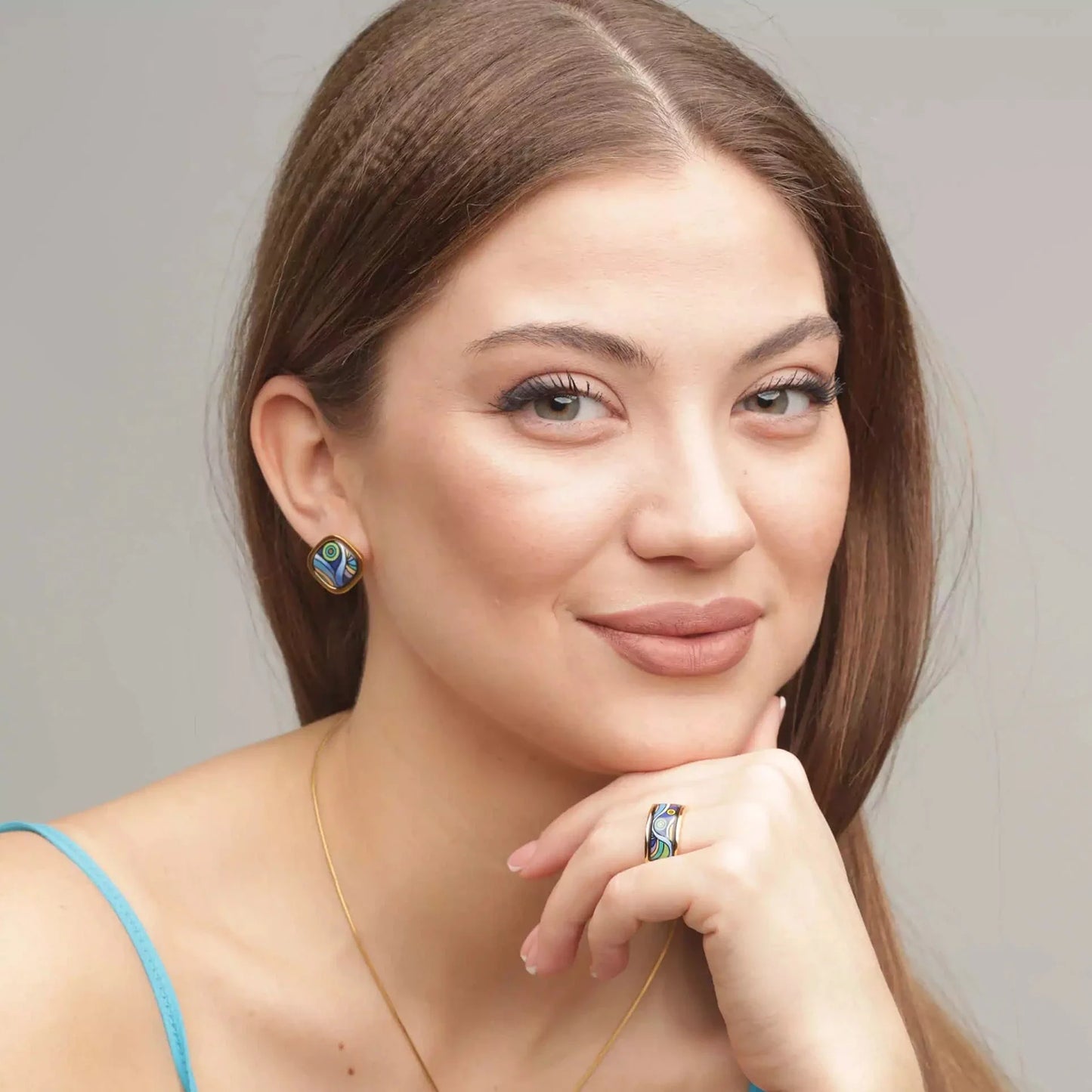 Girl is wearing earrings and a ring from the Starry Night collection